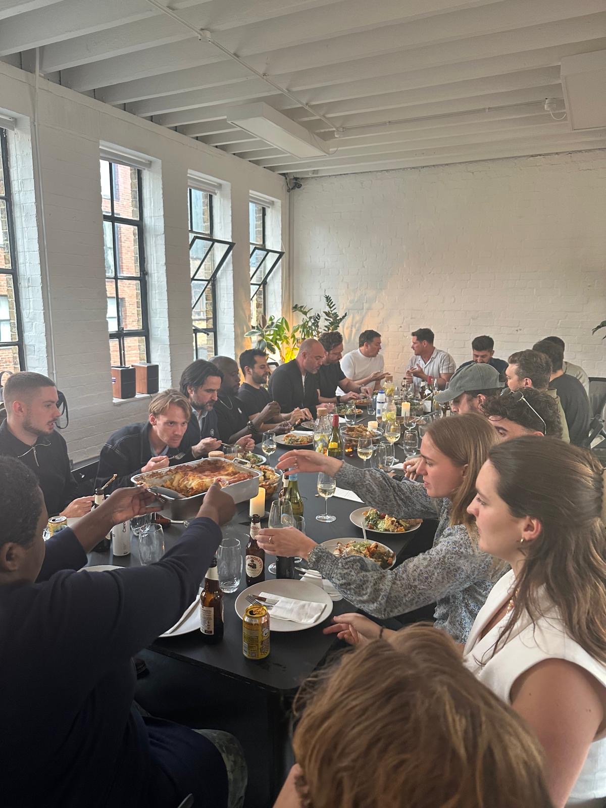 Guests along the long table at the BE:AI Supper Club